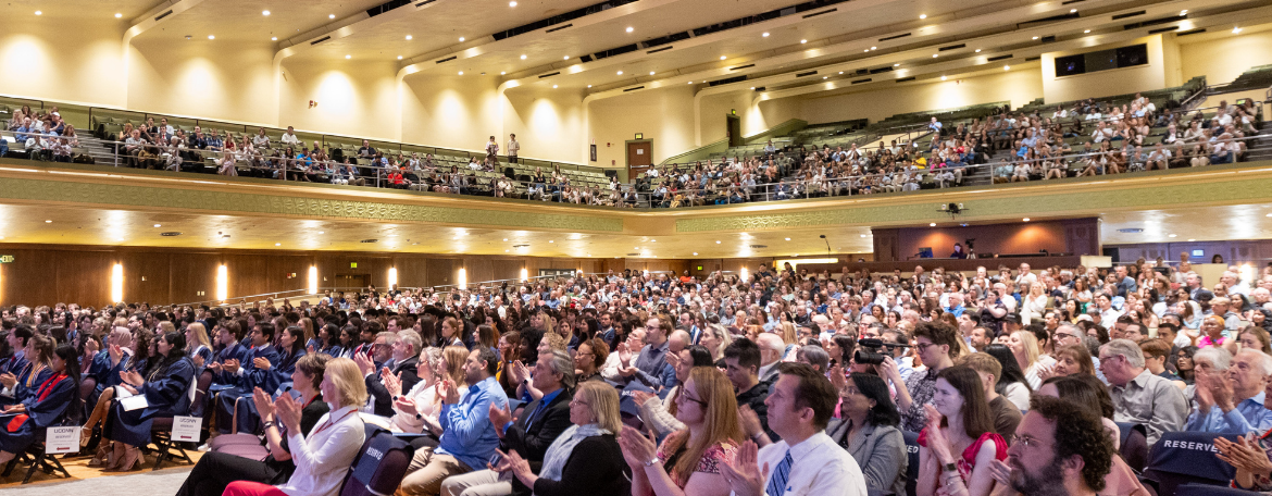 The crowd of hundreds of students and family members in their seats watching the ceremony